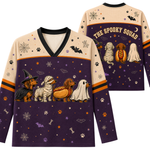 A long-sleeve V-neck shirt shown from the front and back, featuring a Halloween dog-themed print. The front has four dachshunds dressed as a witch, mummy, hot dog, and ghost on a dark purple background with orange and beige sections.