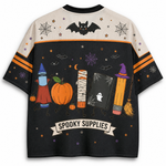 Back view of the Chaotic Club jersey showcasing the backside of the Halloween school supply characters above a ribbon banner reading 'SPOOKY SUPPLIES'.