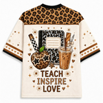 ack view of the custom teacher mesh jersey highlighting the bold typography 'TEACH INSPIRE LOVE' surrounded by a leopard pattern apple, notebook, and coffee cup.