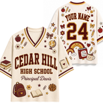 A cream-colored mesh sports jersey shown from both the front and back, featuring 'CEDAR HILL HIGH SCHOOL' and 'Principal Davis' on the front, with customizable 'YOUR NAME' and '24' on the back. The jersey is decorated with school-themed illustrations including a rainbow, backpack, books, and stars in maroon and brown.