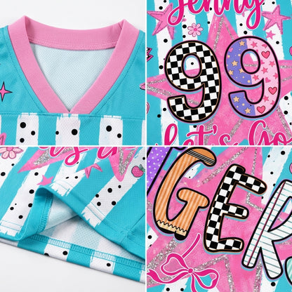 A close-up collage of a children's sports jersey showing the front collar, sleeve cuff, and decorative printed panels. The jersey is turquoise and pink with white polka-dot and striped accents, plus large graphic numbers and lettering in pink, black, white, and orange.