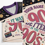 A 4-panel close-up collage of a custom printed V-neck t-shirt. The shirt features a black and purple collar, a cream-colored body, and a distressed 90s Halloween graphic with pink '90's', purple text, ghosts, cassette tapes, and bats.