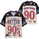 A mockup showing the front and back of a short-sleeve V-neck t-shirt with a 90s Halloween theme. The shirt features a black body with purple trim, a cream-colored front graphic reading 'IT WAS BETTER IN THE 90's' with pink '90's and purple text, and a matching back graphic with 'YOUR NAME 90' in pink.