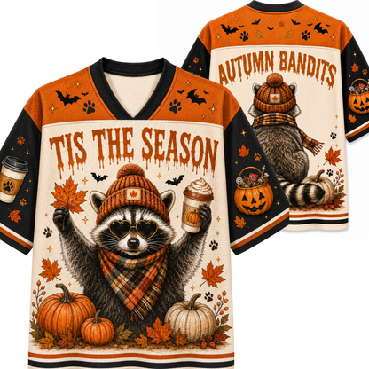Front and back views of a Halloween-themed v-neck jersey sweatshirt featuring a raccoon dressed as an autumn bandit with pumpkins, fall leaves, and the text 'TIS THE Season' and 'AUTUMN BANDITS'.