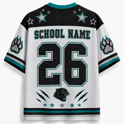 Custom Carolina Panthers-style football jersey shown from the back, with a white body, black shoulders and upper back, teal accents, star graphics, paw prints on the sleeves, 'SCHOOL NAME' text, and the number 26.