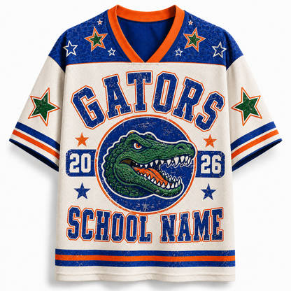 A short-sleeve V-neck jersey-style shirt with a distressed collegiate design. The body is off-white/cream, with blue and orange trim, a large blue 'GATORS' graphic, a green alligator logo in the center, and 'SCHOOL NAME' printed below.