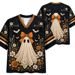 Black short-sleeve V-neck T-shirt with a Halloween ghost graphic, shown front and back. The shirt features a cream lace-textured ghost with an orange bow, surrounded by white and orange flowers, bats, and leaves.
