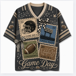 A dark gray v-neck t-shirt with a vintage football theme, featuring four retro postage stamp designs on the front with football helmets, a stadium, a football, and a touchdown, along with 'Game Day' text and striped bow details.