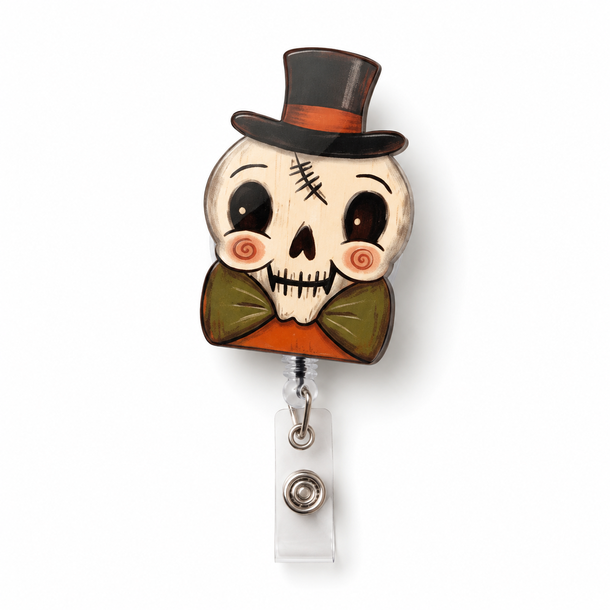 A Halloween-themed retractable badge reel featuring a cartoon skull wearing a black top hat with an orange band, a green bow tie, and rosy cheeks, attached to a clear plastic swivel clip on a white background.