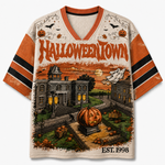 Chaotic Club vintage Halloween town mesh jersey front view showing orange V-neck collar, bold HALLOWEENTOWN typography, town hall, and pumpkin patch.