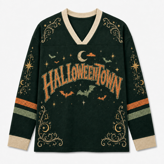A dark forest green long-sleeve V-neck sweater with a distressed orange 'HALLOWEENTOWN' graphic across the chest, decorated with bats, stars, moons, and gold swirl patterns on the sleeves and hem.