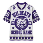 A white and purple short-sleeve football jersey with 'WILDCATS' and a wildcat mascot graphic on the front, plus 'SCHOOL NAME' and paw-print details.