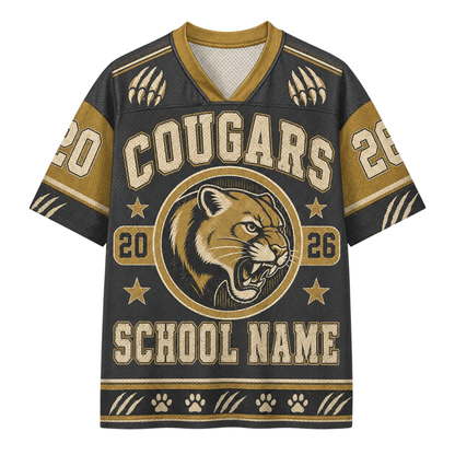 A custom short-sleeve V-neck jersey with a dark charcoal gray body and gold accents, featuring a cougar mascot logo, 'COUGARS' text, and placeholder text 'SCHOOL NAME'.