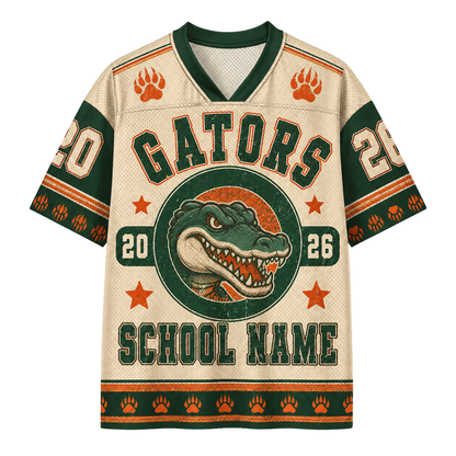 A short-sleeve V-neck football jersey with a cream mesh-like base, dark green trim, and orange accents. The front features a large alligator graphic inside a circle with the word 'GATORS' above it, plus 'SCHOOL NAME' and numbers '20' and '26'.