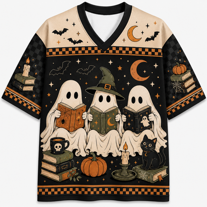 A short-sleeve V-neck t-shirt featuring a detailed Halloween graphic print. The design shows three ghosts reading books, a witch hat, a black cat, pumpkins, candles, and bats against a black and beige background with orange accents.