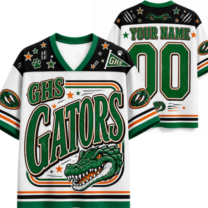 Customizable high school football jersey shown from both front and back. The jersey features a white base with green and black accents, decorated with stars, paw prints, a green alligator mascot graphic, and placeholder text 'GHS GATORS' and 'YOUR NAME 00'.
