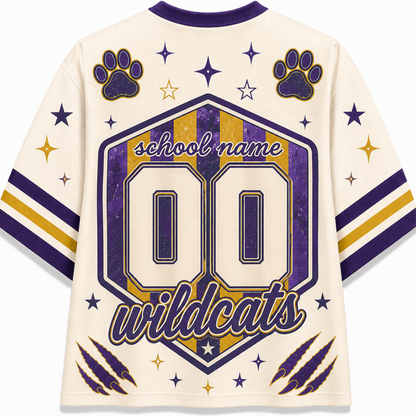 Customizable cream-colored athletic jersey shirt with purple and gold graphics, featuring a large '00' and 'wildcats' text on the back, along with paw prints and stars.