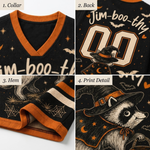 Four-panel product detail collage showing a black V-neck top with orange trim and Halloween-themed graphics: partial front text, back with large '00' and 'Jim-boo-thy', hem with spiderwebs and orange trim, and a raccoon print detail wearing a witch hat.