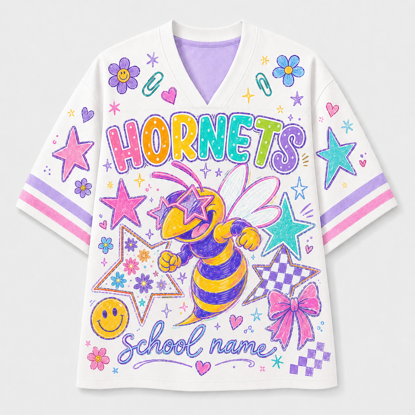 A white short-sleeve V-neck t-shirt with a colorful school-themed graphic print featuring a hornet, stars, flowers, and the text 'HORNETS' and 'school name'.