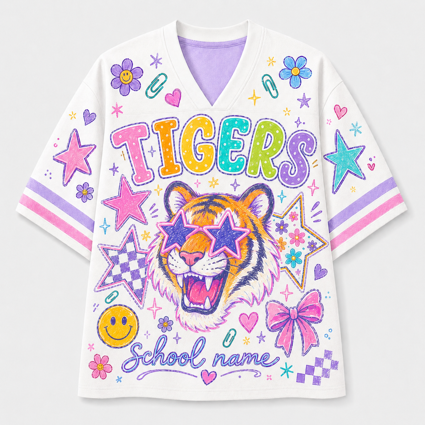 A white short-sleeve V-neck t-shirt featuring a colorful graphic design with a tiger wearing star-shaped sunglasses, the word 'TIGERS' in rainbow letters, and 'School name' script. The shirt is decorated with stars, bows, smiley faces, and pink and purple stripes on the sleeves.