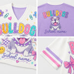 A four-panel product collage showing a V-neck graphic T-shirt from the front, back, and sleeve details. The shirt features colorful 'BULLDOG' lettering, a bulldog illustration, 'School name' text, and pastel purple and pink striped sleeve accents.