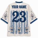 Back view of a customizable cream-colored jersey with blue trim, featuring a large blue number 23, 'YOUR NAME' text, and blue-and-white striped coffee cup graphics.