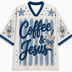 A cream-colored mesh football-style jersey with blue trim, featuring the words 'Coffee & Jesus' in large blue script over a distressed blue-and-white striped background, decorated with blue stars and coffee cup illustrations on the sleeves.
