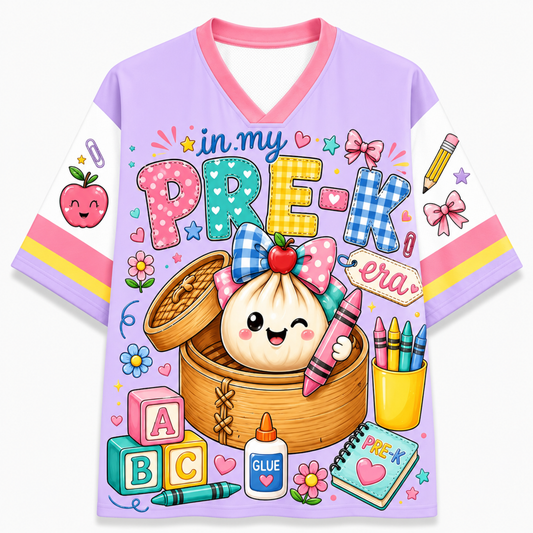 A short-sleeve V-neck t-shirt with a colorful cartoon graphic on the front. The shirt features a light purple body, pink collar and sleeve trim, and white sleeves.