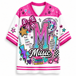 A white and pink V-neck graphic t-shirt featuring a colorful retro 90s/2000s 'Music' theme with a large glittery 'M', a disco ball, a pink bow, stars, and motivational text.