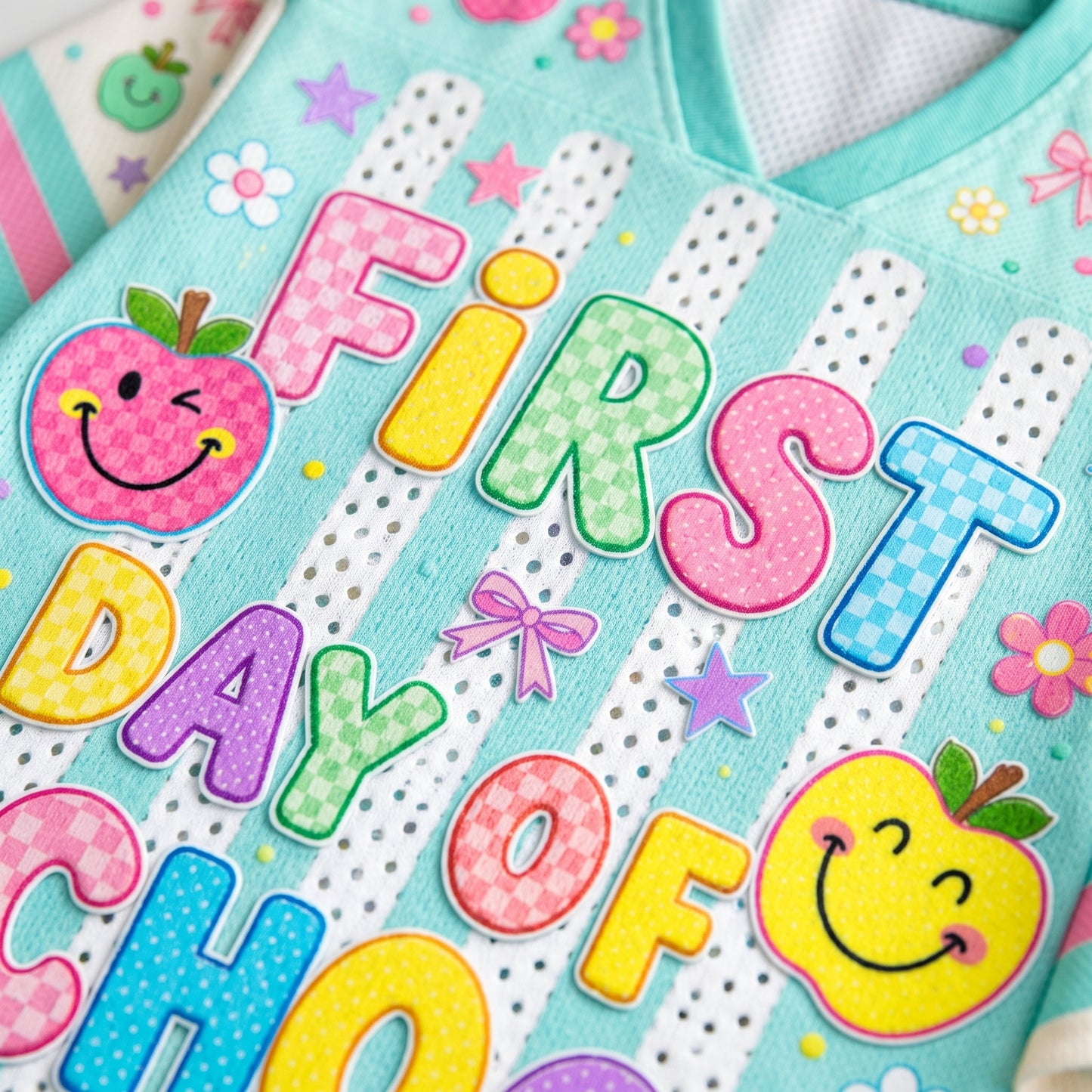 Compilation of detail shots on ChaoticClub school jersey showing the ribbed V-neck, athletic sleeve stripes, high-quality vibrant graphics, and hem texture.