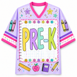 A light purple short-sleeve V-neck jersey-style shirt with a colorful school-themed graphic. The front features the word 'PRE-K' in large pastel letters inside a notebook-style border, surrounded by smiley faces, crayons, stars, a ruler, an apple, and other school supplies.