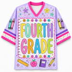 A light purple short-sleeve V-neck t-shirt with a colorful 'Fourth Grade' school-themed graphic on the front, featuring crayons, smiley faces, a ruler, an apple, and a notebook.