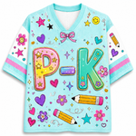 A light blue V-neck short-sleeve t-shirt with 'P-K' printed in large, colorful, glittery letters. The shirt is decorated with various school-themed graphics including pink and yellow smiley-faced flowers, purple and blue hearts, stars, bows, and yellow pencils with pink erasers.