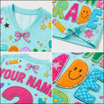 A collage showing a light blue children's shirt with colorful custom applique details, including letters, smiley faces, stars, flowers, and a bow. The shirt features a V-neck and mesh lining.