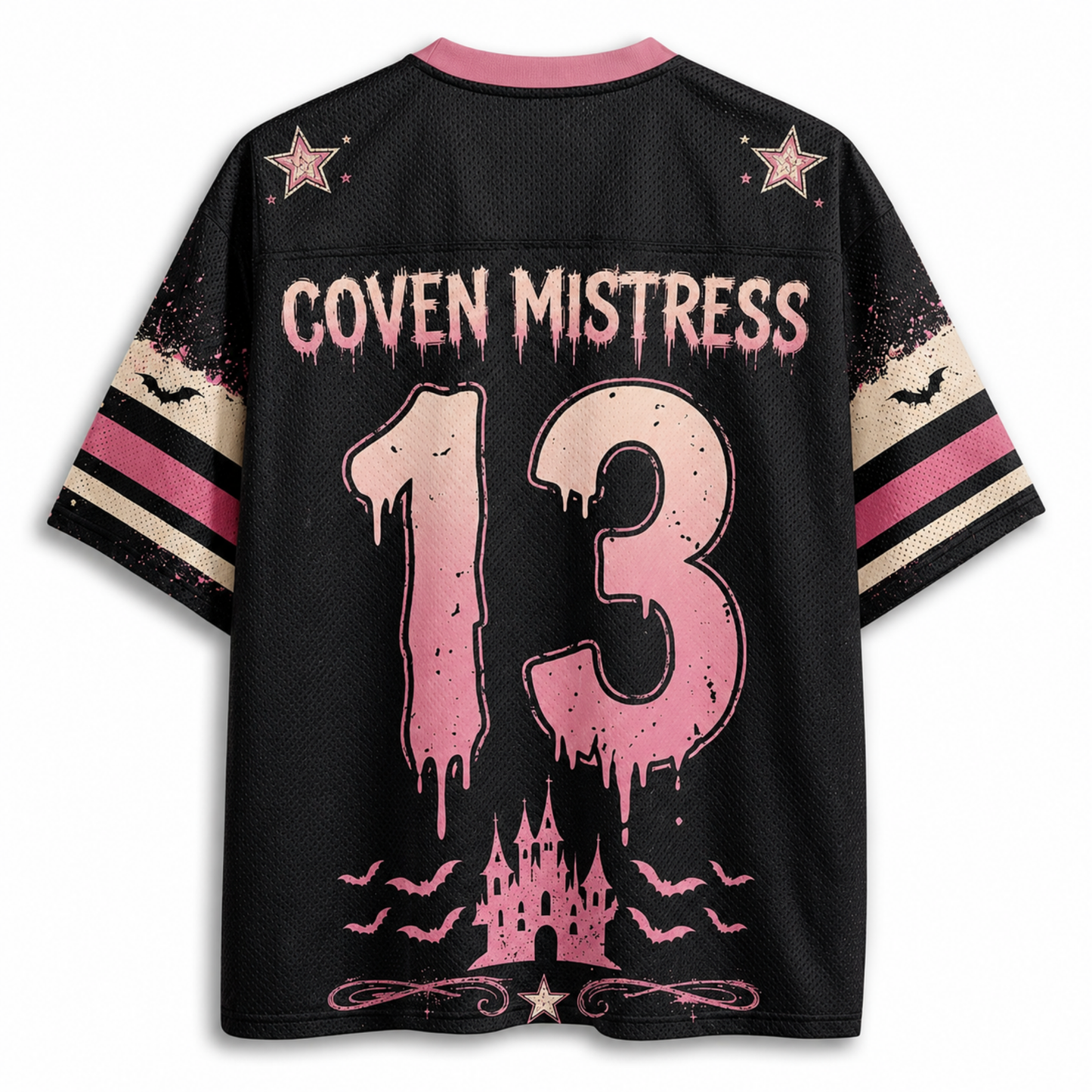 A black short-sleeve jersey-style shirt shown from the back, featuring pink and beige graphic details. The back has a pink collar, pink stars, the text 'COVEN MISTRESS' across the upper back, a large distressed pink number '13' in the center, and a pink castle with bats near the hem.