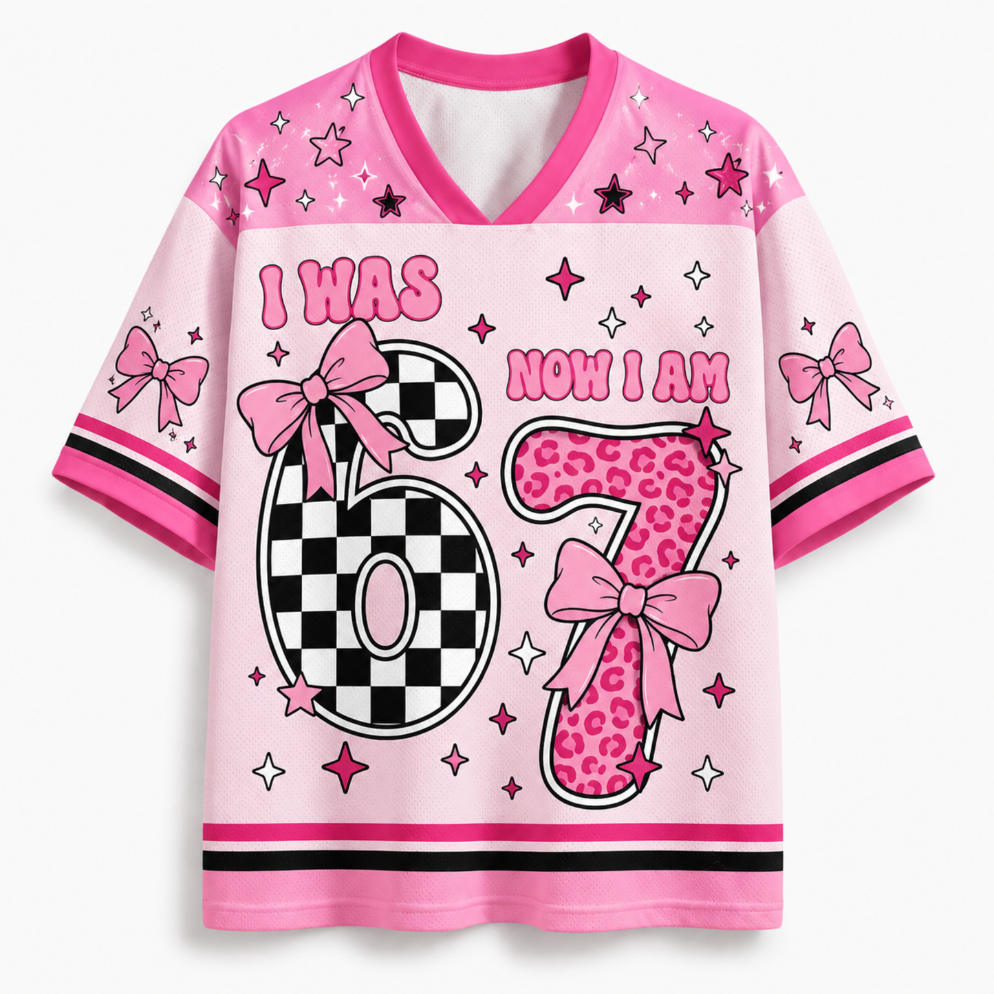 A pink short-sleeve V-neck t-shirt with a 'I WAS NOW I AM 6' birthday graphic. The number 6 is split into a black-and-white checkerboard pattern on the left and a pink leopard print pattern on the right, decorated with pink bows.