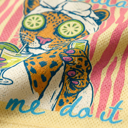 Close-up of the leopard spa graphic on the yellow mesh fabric, showing the fine print details of the cucumber slices and the drink held by the leopard.