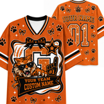 Custom orange and black sports jersey shown from both front and back, featuring a wildcat graphic with sunglasses, paw prints, bows, stars, and customizable text including 'YOUR NAME', '01', and 'YOUR TEAM CUSTOM NAME'.