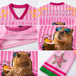 Close-up details of the ChaoticClub Capy Holiday pink mesh jersey showing the breathable fabric texture, "Capy Holiday" back print, starfish sleeve embroidery, and high-quality capybara graphic wearing sunglasses and holding a coconut drink.