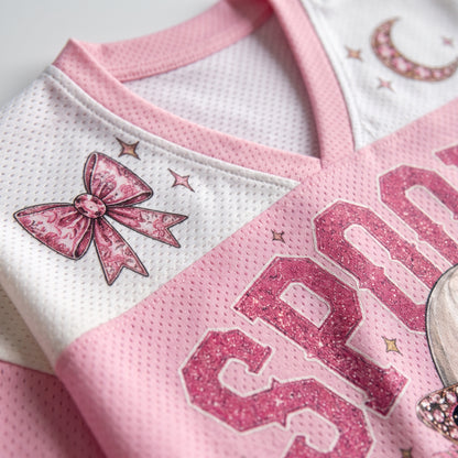Close up view of the pink V-neck collar on ChaoticClub glam ghost jersey showcasing the white mesh paneling and a cute pink leopard bow design.