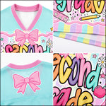 Collage of pastel-colored clothing with bows and colorful text, resembling a children's outfit design.