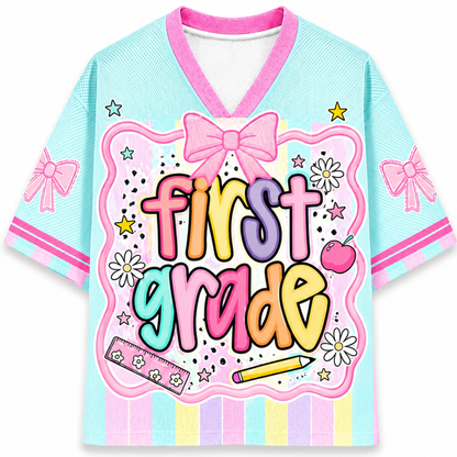 Colorful 'First Grade' jersey with bows and decorative elements on a white background