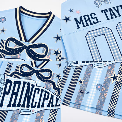 Detailed close up of ChaoticClub Principal jersey print showing the textured navy blue PRINCIPAL typography, sparkling stars, and fabric weave.
