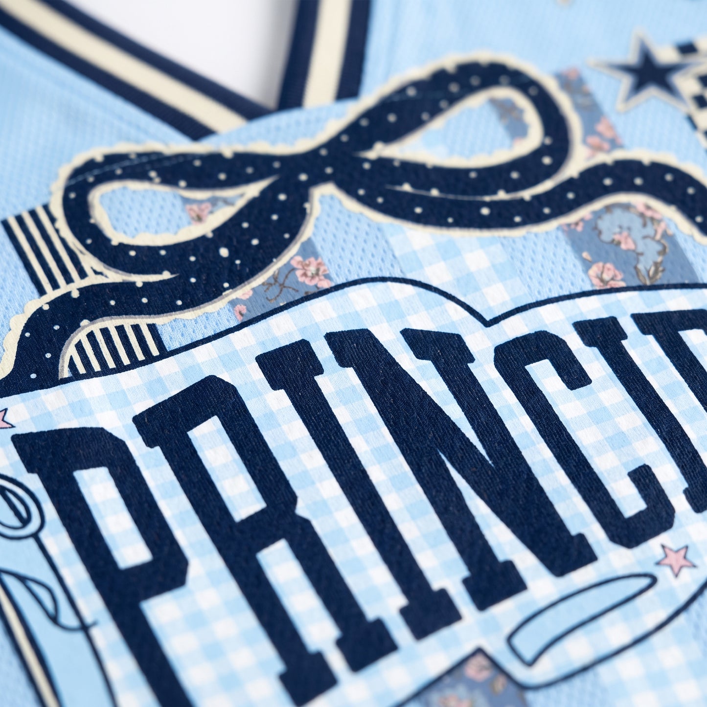Close-up of a decorative item with 'PRINCESS' text on a blue background