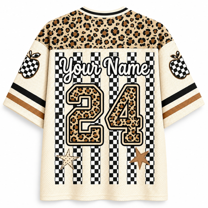 Customizable short-sleeve jersey shirt with a leopard print and checkered design. Features a leopard print yoke, striped sleeves with apple graphics, and a large customizable number 24 on the back.