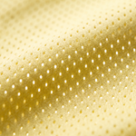 Extreme macro shot of the yellow pro-mesh breathable fabric, highlighting the airy knit texture designed for maximum comfort during hot summer days.