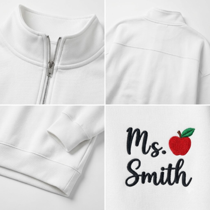 A white zip-up sweatshirt shown in a four-panel collage, highlighting the collar and zipper, the back view, the sleeve cuff, and a custom embroidered design on the front that reads 'Ms. Smith' with a red apple.