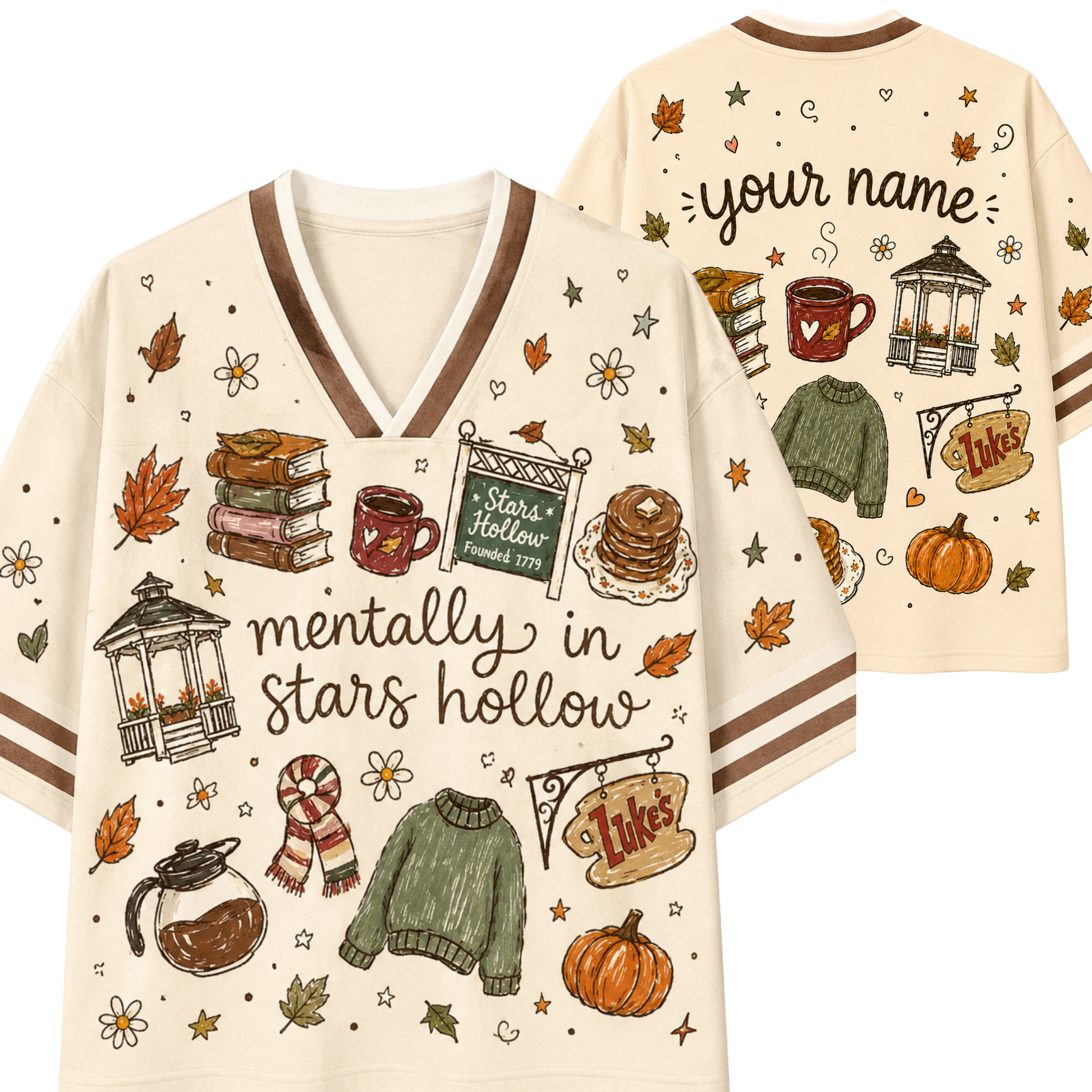A cream-colored V-neck t-shirt with brown trim, featuring autumn-themed illustrations and the text 'mentally in stars hollow' on the front. The back view shows customizable text reading 'your name' along with additional seasonal graphics.
