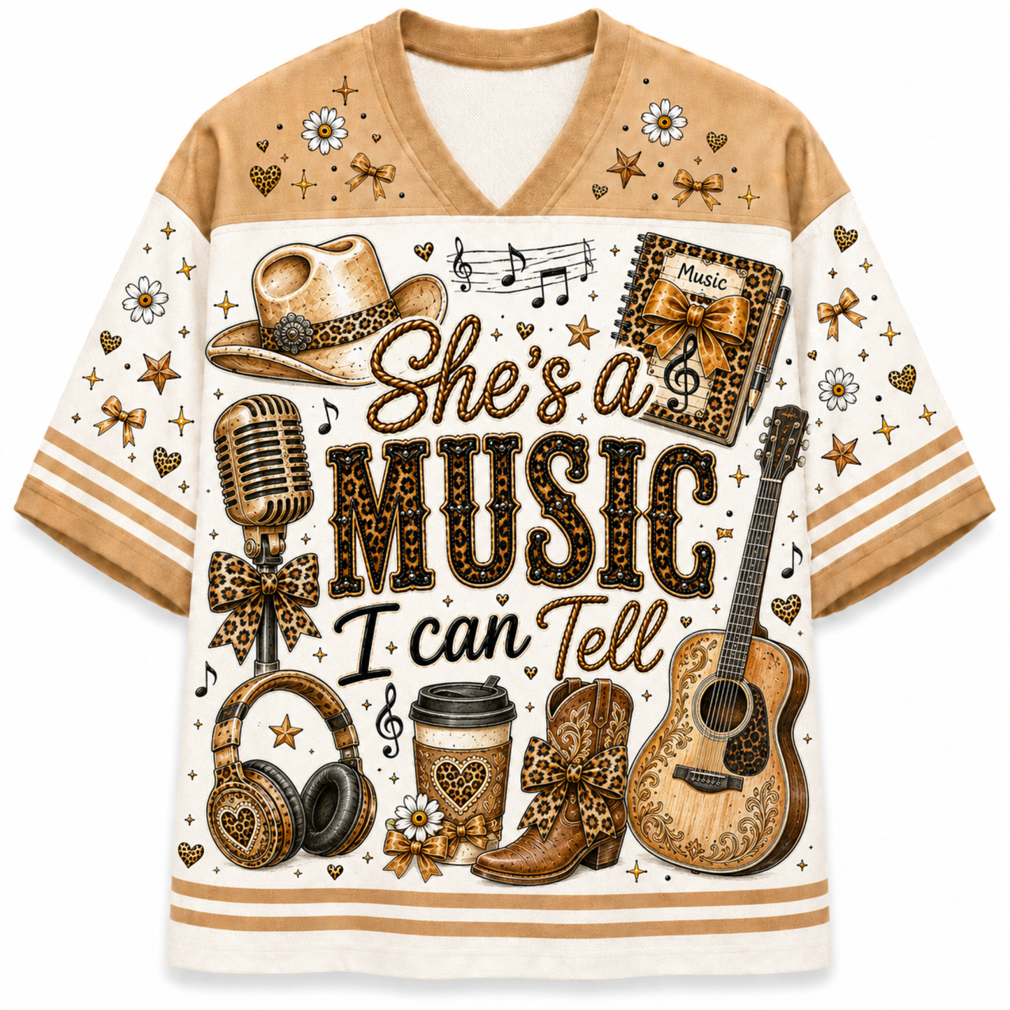 A short-sleeve V-neck t-shirt with a western music theme, featuring a cream and tan base with a detailed graphic print of a cowboy hat, guitar, headphones, boots, a microphone, and the text 'She's a MUSIC I can Tell' in a leopard-print style.