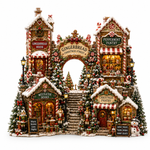 A highly detailed, symmetrical Christmas village miniature display featuring a gingerbread archway labeled 'Gingerbread Christmas Street,' with storefronts for Gingerbread House, Peppermint Pantry, Mistletoe Books, and Christmas Pantry, surrounded by decorated trees, candy canes, gifts, and warm glowing windows on a white background.